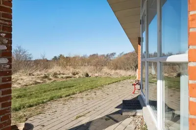 a porch of a house with a view of a field at LF10229-Thyholm-Skovstjernevej-9 in Thyholm