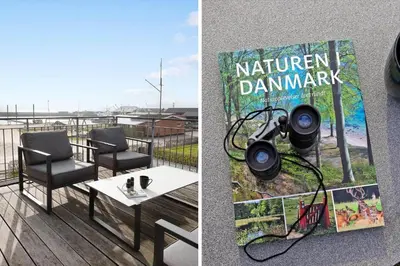 a camera on the side of a balcony with a table and chairs at LF10214-Thyholm-Havnefronten-14 in Thyholm