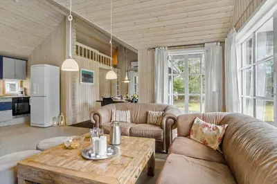 a living room with two couches and a table at LF10307-Hurup-Thy-Traelobervej-7 in Sønder Ydby