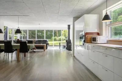 a kitchen and dining room with a table and chairs at LF10302-Hurup-Thy-Skibstedsvej-22-B in Sønder Ydby