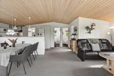 a living room with a couch and a table at LF11103-Struer-Blabaervej-3 in Struer