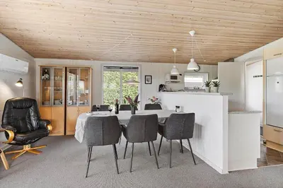 a kitchen and dining room with a table and chairs at LF11103-Struer-Blabaervej-3 in Struer