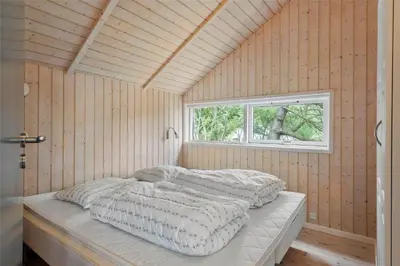 two beds in a room with a window at LF21631-Spottrup-Vibevej-3 in Spottrup