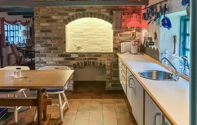 a kitchen with a sink and a brick wall at Gorgeous Home In Vemb With Wifi in Vemb
