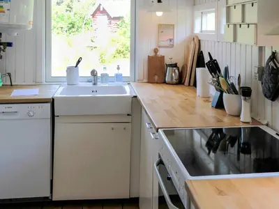 a kitchen with a sink and a counter at Welcoming 6 person holiday home in Blokhus in Blokhus