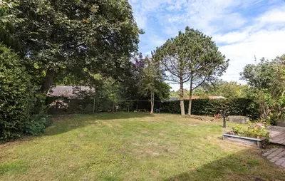 a yard with a bench and some trees at Pet Friendly Home In Farsø With House A Panoramic View in Farsø