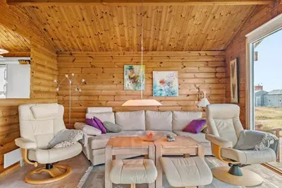 a living room with a couch and chairs and a table at JB356-Frostrup-Horsbakkevej-6 in Frøstrup