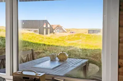a table with a pumpkin sitting on top of a window at JB356-Frostrup-Horsbakkevej-6 in Frøstrup