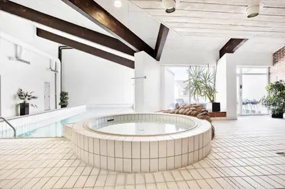 a hot tub in a room with a pool at JB181-Brovst-Strandvejen-150-Lejl-142 in Brovst