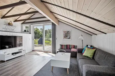 a living room with a couch and a tv at JB578-Fjerritslev-Hasselvej-57 in Fjerritslev