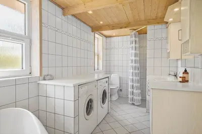 a white bathroom with a washing machine in it at JB290-Fjerritslev-Mollebosletten-41 in Fjerritslev
