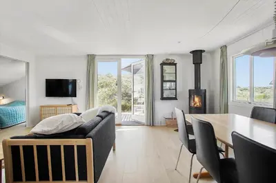 a living room with a couch and a table at JB183-Frostrup-Svenstibakkevej-70 in Frøstrup