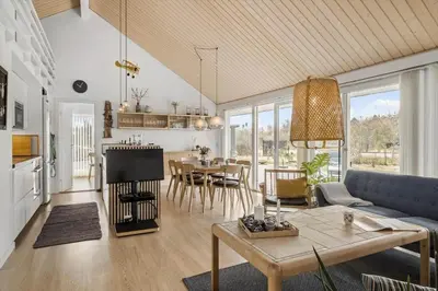 a living room with a couch and a table at JB307-Brovst-Kronvildtvej-130 in Brovst