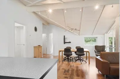 a living room with a dining room table and chairs at JB901-Aabybro-Graanden-40 in Åbybro