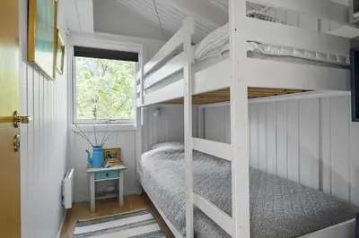 a white bunk bed in a white room with a window at JB922-Fjerritslev-Birkevej-25 in Fjerritslev