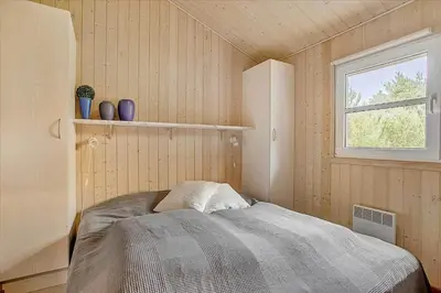 a bedroom with a bed and a window at JB699-Fjerritslev-Revlingestien-43 in Fjerritslev
