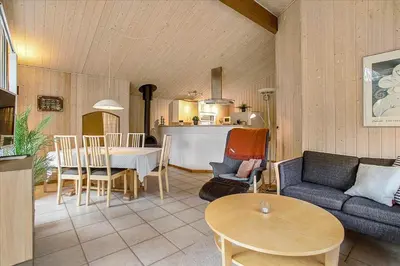 a living room with a couch and a table at JB699-Fjerritslev-Revlingestien-43 in Fjerritslev