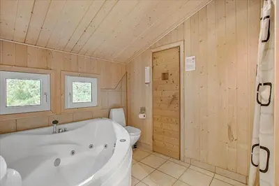 a large bathroom with a tub and a toilet at JB699-Fjerritslev-Revlingestien-43 in Fjerritslev