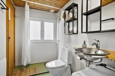 a small bathroom with a toilet and a sink at JB155-Frostrup-Svenstibakkevej-5 in Frøstrup