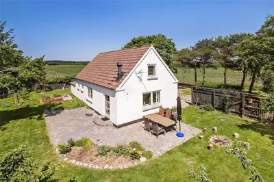 an aerial view of a small white house at JB151-Brovst-Tranum-Engevej-137 in Brovst