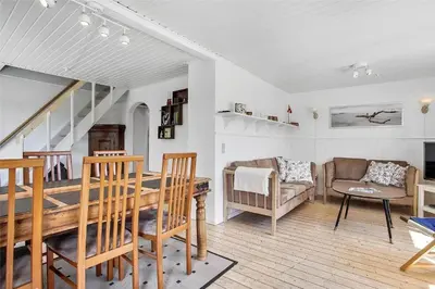 a living room with a table and a couch at JB151-Brovst-Tranum-Engevej-137 in Brovst