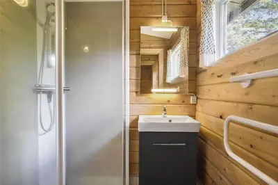 a bathroom with a sink and a shower at JB988-Fjerritslev-Skovstien-6 in Fjerritslev