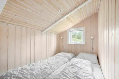 a room with two beds in it with a window at JB818-Fjerritslev-Ronnevej-20 in Fjerritslev