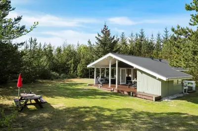 a small shed with a deck and a picnic table at JB157-Brovst-Krogen-24 in Brovst