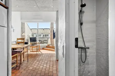 a view of a kitchen and dining room from the hallway of a house at JB889-Brovst-Strandvejen-150-Lejl-130 in Brovst