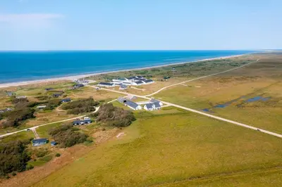 an aerial view of a house next to the ocean at JB889-Brovst-Strandvejen-150-Lejl-130 in Brovst