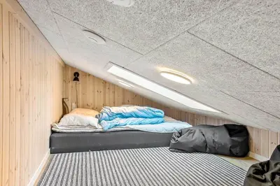 a small room with a bed in the ceiling at JB164-Fjerritslev-Poppelvej-16 in Fjerritslev