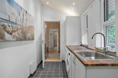 a kitchen with a sink and a counter top at JB136-Brovst-Harestien-1 in Brovst