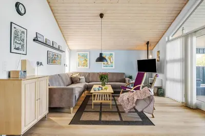 a living room with a couch and a table at JB299-Brovst-Kronvildtvej-224 in Brovst