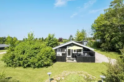 a home with a large yard with a house at JB236-Fjerritslev-Ahornvej-22 in Fjerritslev