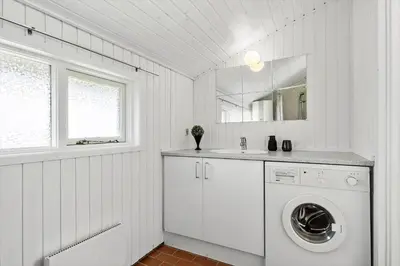 a white laundry room with a washing machine in it at JB236-Fjerritslev-Ahornvej-22 in Fjerritslev