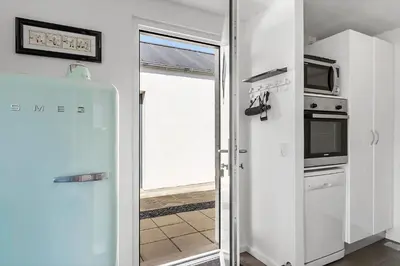 a kitchen with a refrigerator and a microwave at JB302-Fjerritslev-Slettestrandvej-134-lejl-6 in Fjerritslev