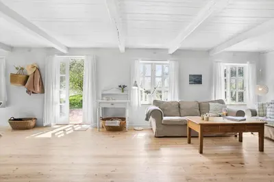 a living room with a couch and a table at JB199-Fjerritslev-Svinklovvej-403 in Fjerritslev