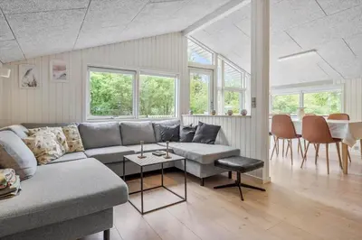 a living room with a couch and a table at JB118-Fjerritslev-Ahornvej-8 in Fjerritslev