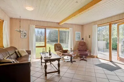 a living room with couches and chairs and a table at JB186-Fjerritslev-Gyvelstien-27 in Fjerritslev
