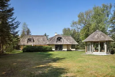 a large house with a thatched roof and a yard at JB186-Fjerritslev-Gyvelstien-27 in Fjerritslev