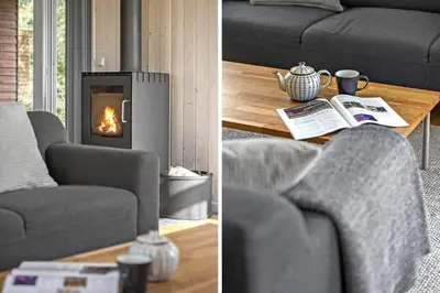 a living room with a couch and a fireplace at JB242-Fjerritslev-Poppelvej-8 in Fjerritslev