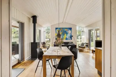 a dining room with a table and chairs at JB242-Fjerritslev-Poppelvej-8 in Fjerritslev