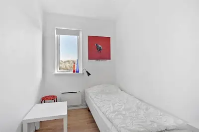 a white room with a bed and a window at JB140-Frostrup-Svenstibakkevej-68 in Frøstrup