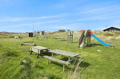 a park with benches and a playground with a slide at JB140-Frostrup-Svenstibakkevej-68 in Frøstrup