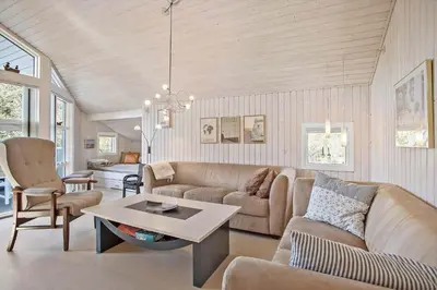a living room with a couch and a table at JB185-Fjerritslev-Poppelvej-26 in Fjerritslev