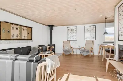 a living room with a couch and a table at JB109-Frostrup-Strandkaervej-8 in Frøstrup