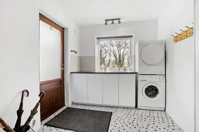 a white laundry room with a washer and dryer at JB148-Fjerritslev-Svinklovvej-107 in Fjerritslev