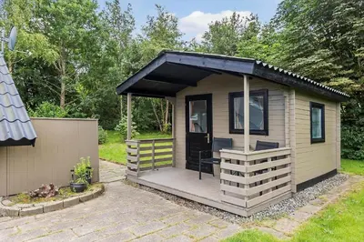 a small shed with a porch and a patio at JB273-Fjerritslev-Hasselvej-39 in Fjerritslev