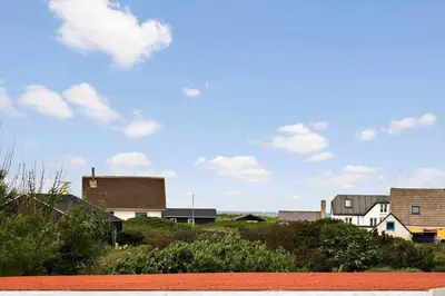 a group of houses on a hill with a blue sky at JB234-Frostrup-Strandvejen-83-A in Frøstrup