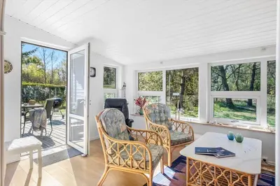 a living room with chairs and a table at JB246-Brovst-Graevlingevej-13 in Brovst